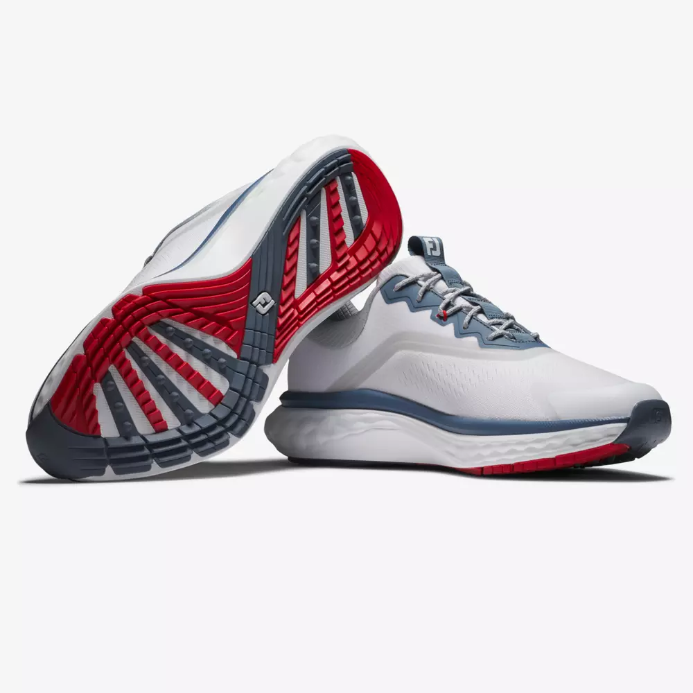 A pair of white athletic shoes with gray and red accents; one shoe is upright while the other is on its side, displaying the red and gray patterned sole&mdash;perfect contenders for best golf shoes 2026.