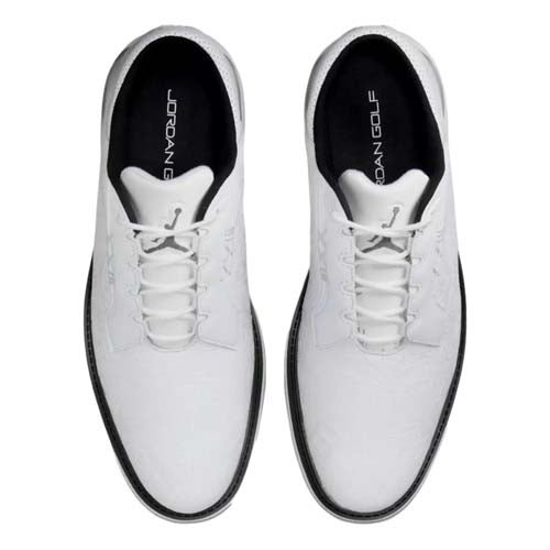 Top view of the best Jordan golf shoes in white, featuring black interiors and JORDAN GOLF text on the insoles. These shoes have white laces and a simple, clean design.