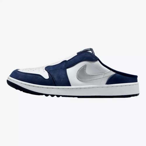 A slip-on Nike mule sneaker with a white upper, navy blue accents, a gray Nike swoosh, and a low backless design—offering laid-back style inspired by the best Jordan golf shoes, shown on a plain white background.