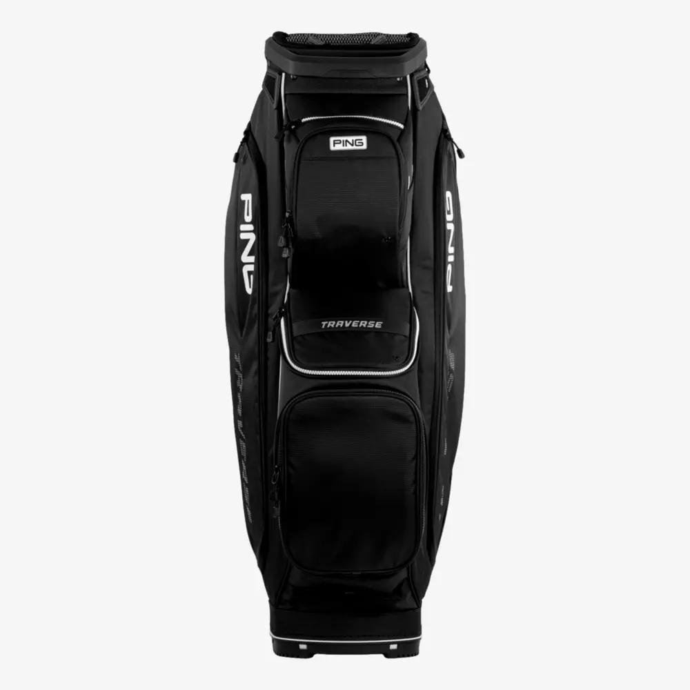 A black PING Traverse golf bag, one of the best golf bags 2026, stands upright against a plain white background. It features multiple zippered pockets and distinctive white PING branding on the sides.