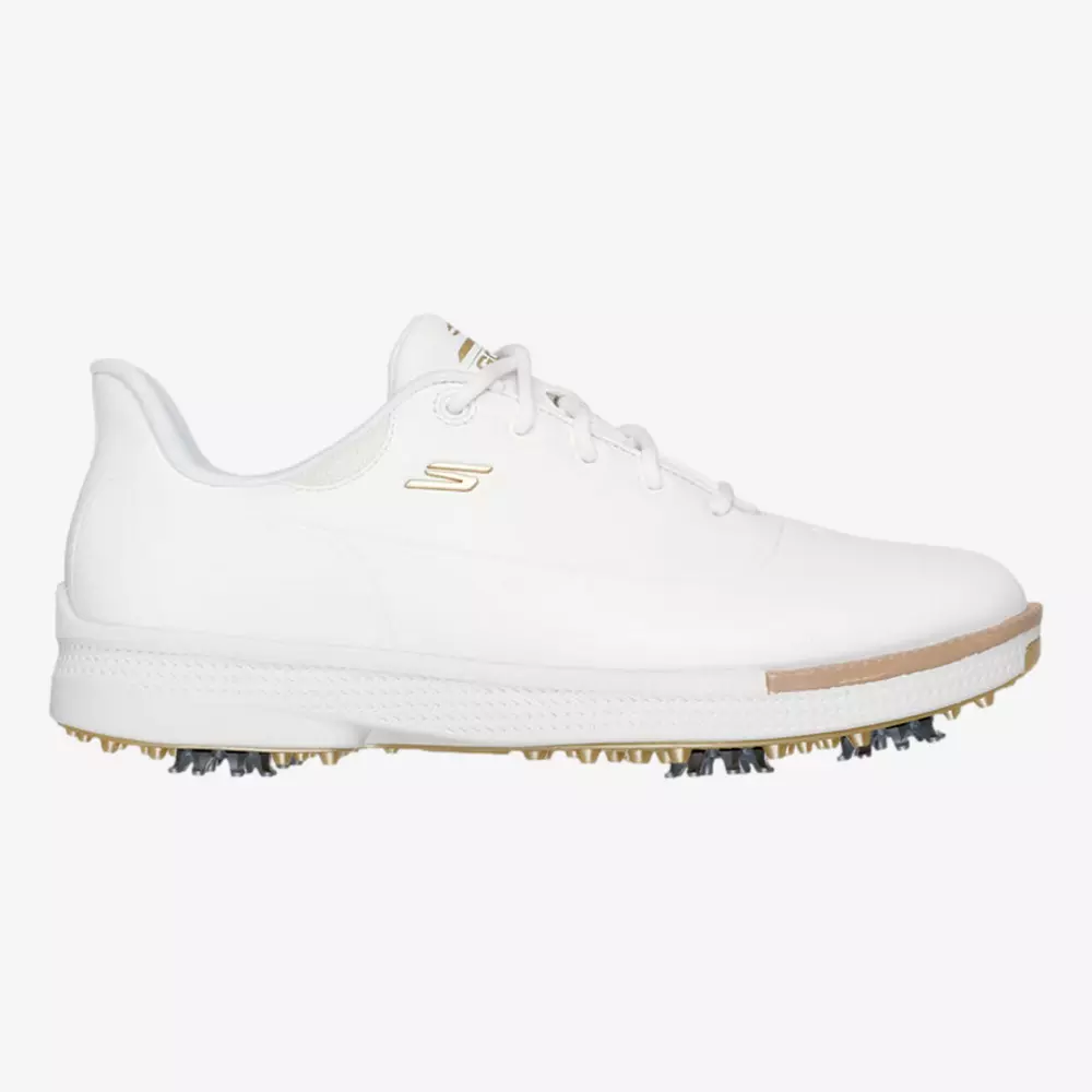A white athletic golf shoe with a low profile, gold detailing, and a textured sole featuring soft spikes for traction&mdash;perfect for those seeking the best women's golf shoes 2026.