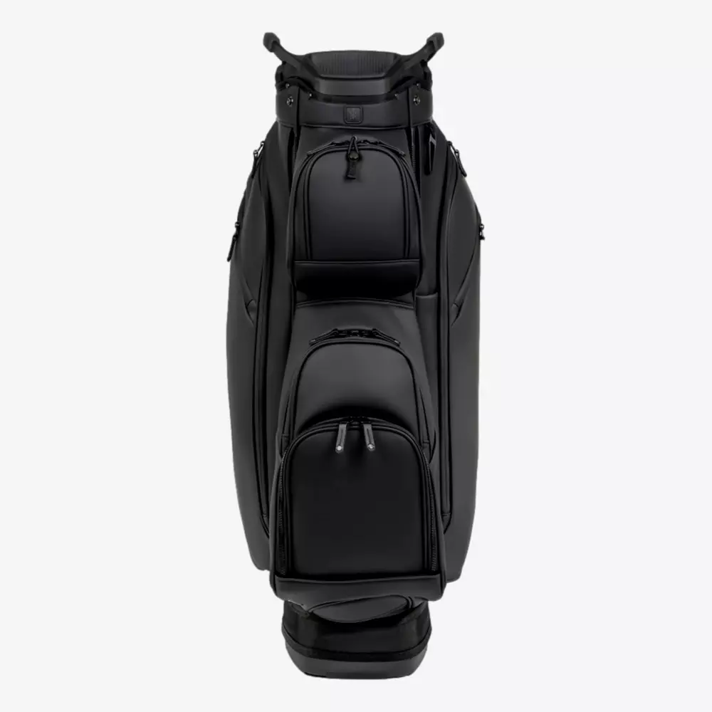 A black golf bag with multiple zippered pockets and a sturdy handle, shown standing upright against a plain white background&mdash;an ideal choice among the best golf bags 2026 has to offer.