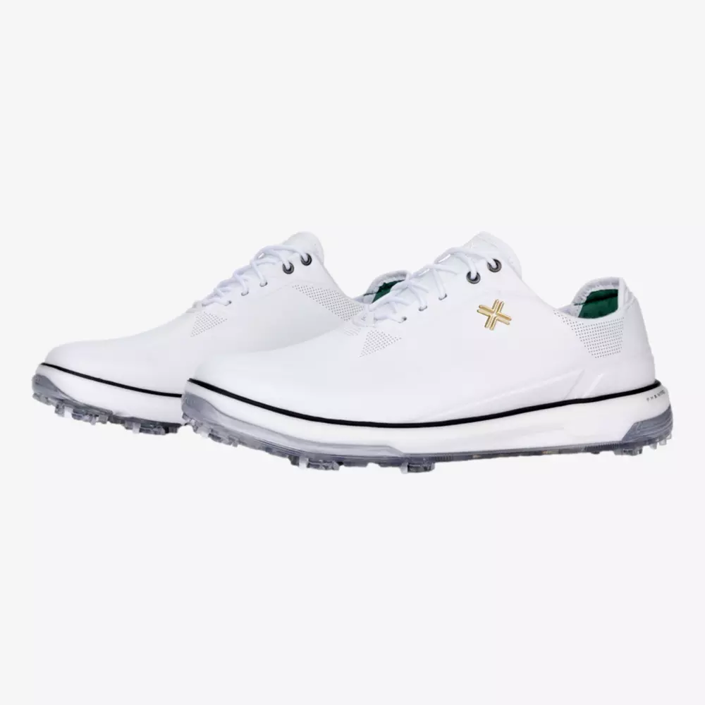 A pair of white athletic shoes with clear soles, black trim above the sole, and a small gold logo on the side&mdash;these stylish kicks are inspired by the best Jordan golf shoes, displayed perfectly on a white background.