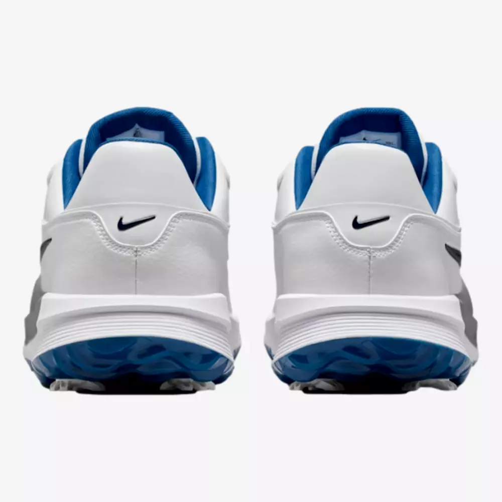 A pair of white athletic shoes with blue inner lining and black Nike swoosh logos on the heel, viewed from the back against a plain background&mdash;ideal for those seeking the best golf shoes 2026 has to offer.