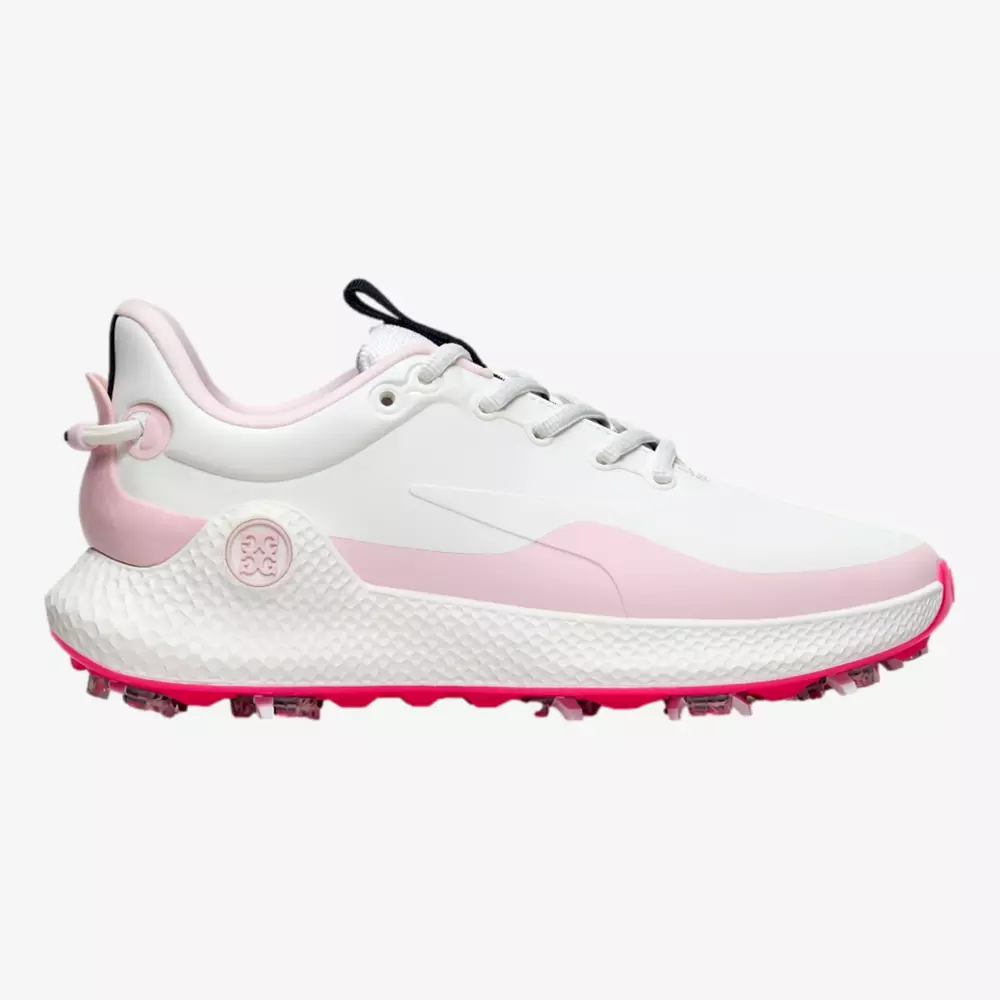 A white athletic sneaker with light pink accents, pink outsole, and textured sole designed for grip. Inspired by the best golf shoes 2026, it features laces, a padded collar, and a logo on the side.
