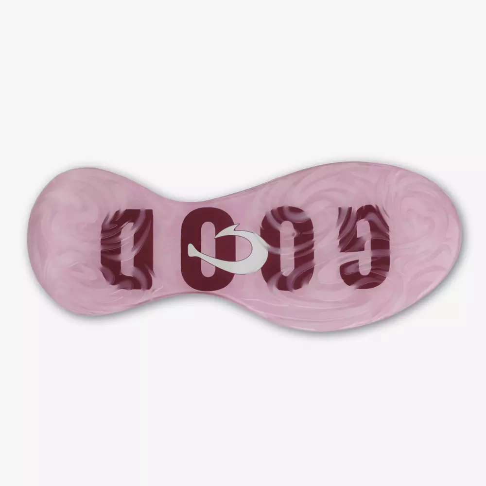 The image shows the pink marbled sole of a shoe with the word GOOD in bold, dark red letters and a white arrow forming the letter O&mdash;a fresh look for those seeking the best golf shoes 2026 has to offer.