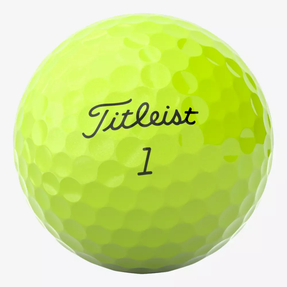 A close-up of a bright yellow Titleist golf ball, considered among the best golf balls 2026, with the number 1 printed below the brand name on a white background.