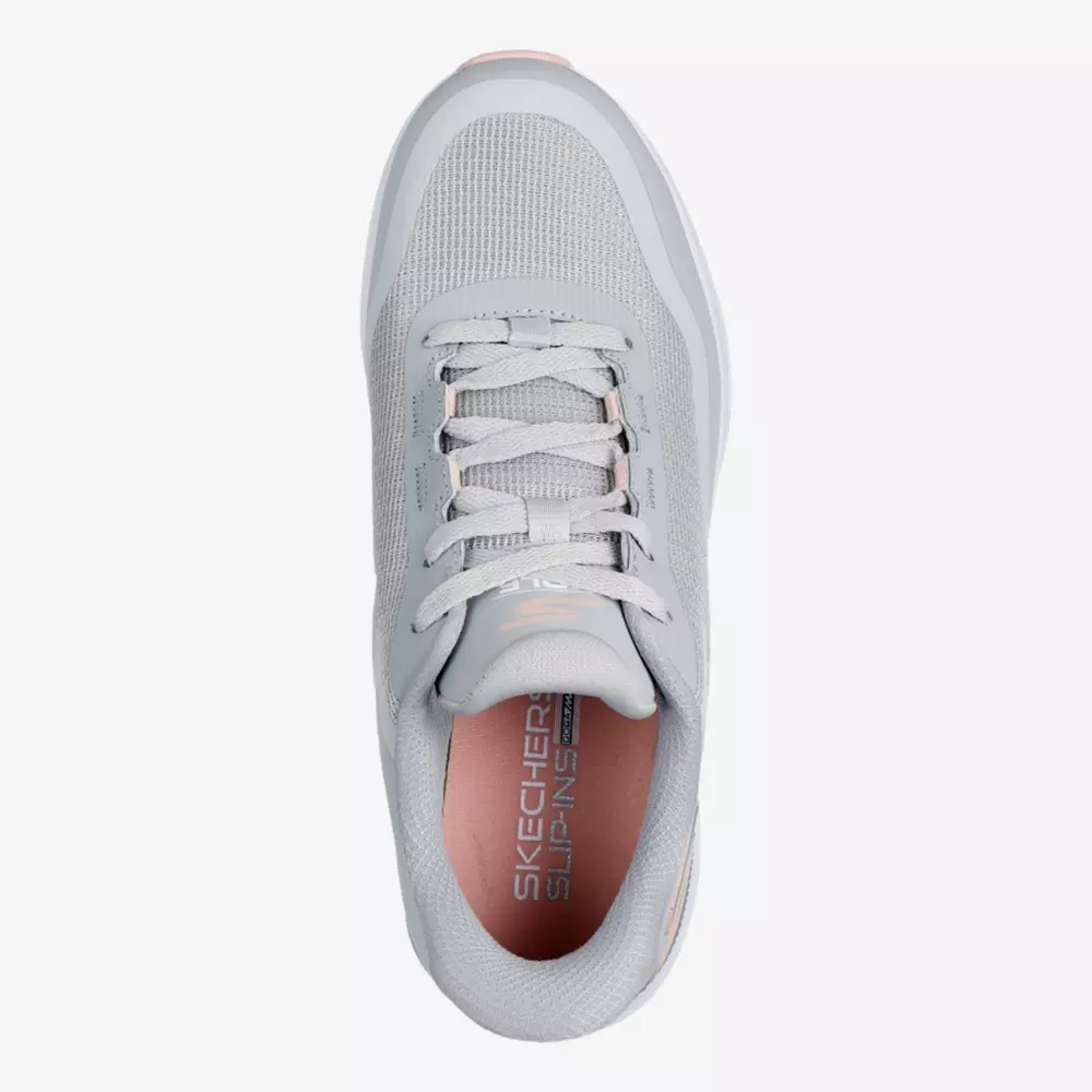 Top view of a light gray Skechers slip-ins sneaker with white laces, mesh upper, and pale pink insole featuring the Skechers logo&mdash;designed for comfort and style, making it a contender for best women's golf shoes 2026.