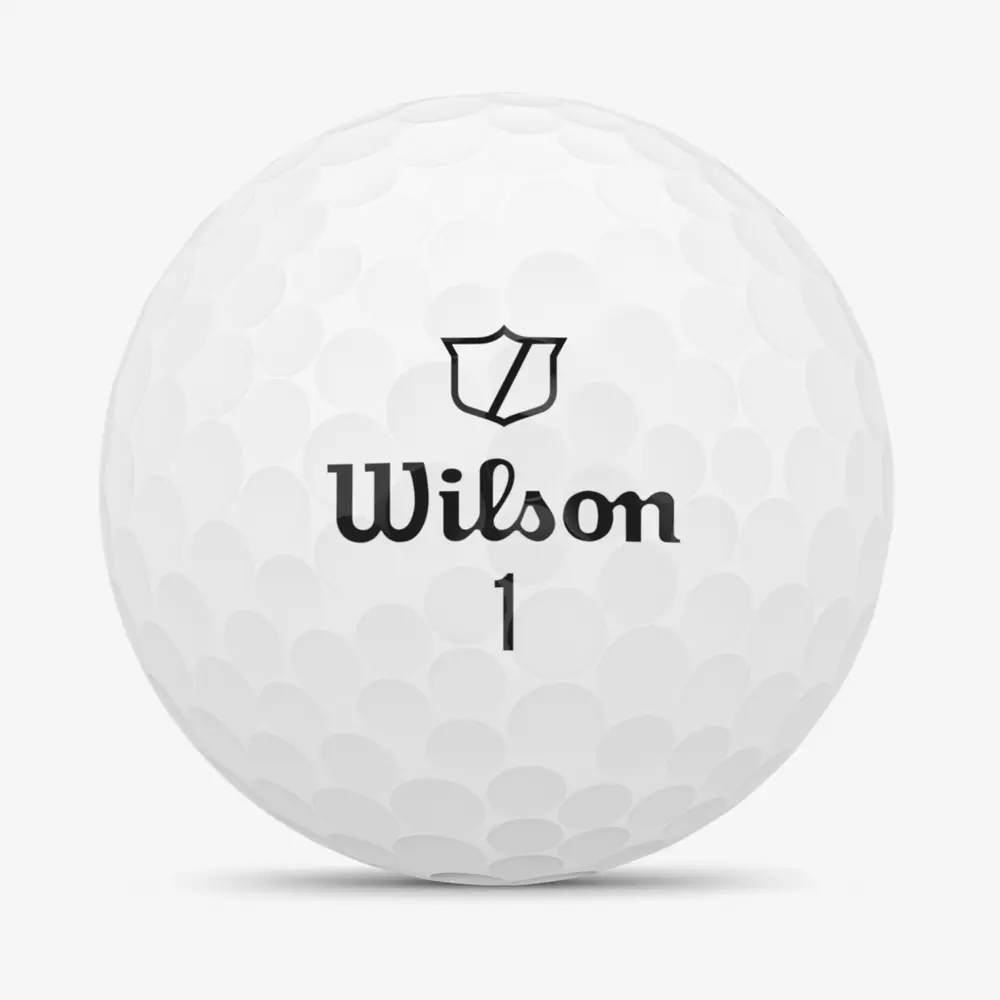 A white golf ball with dimples, featuring the Wilson logo, a shield symbol, and the number 1 printed on its front. The background is plain white, perfect for pairing with the best golf shoes 2026.