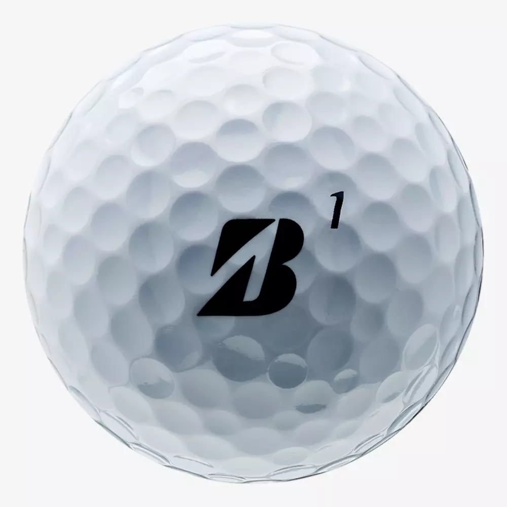 A close-up of a dimpled white golf ball featuring a bold black B logo and the number 1 printed on its surface, perfect for pairing with the best golf shoes 2026 for an unbeatable game.