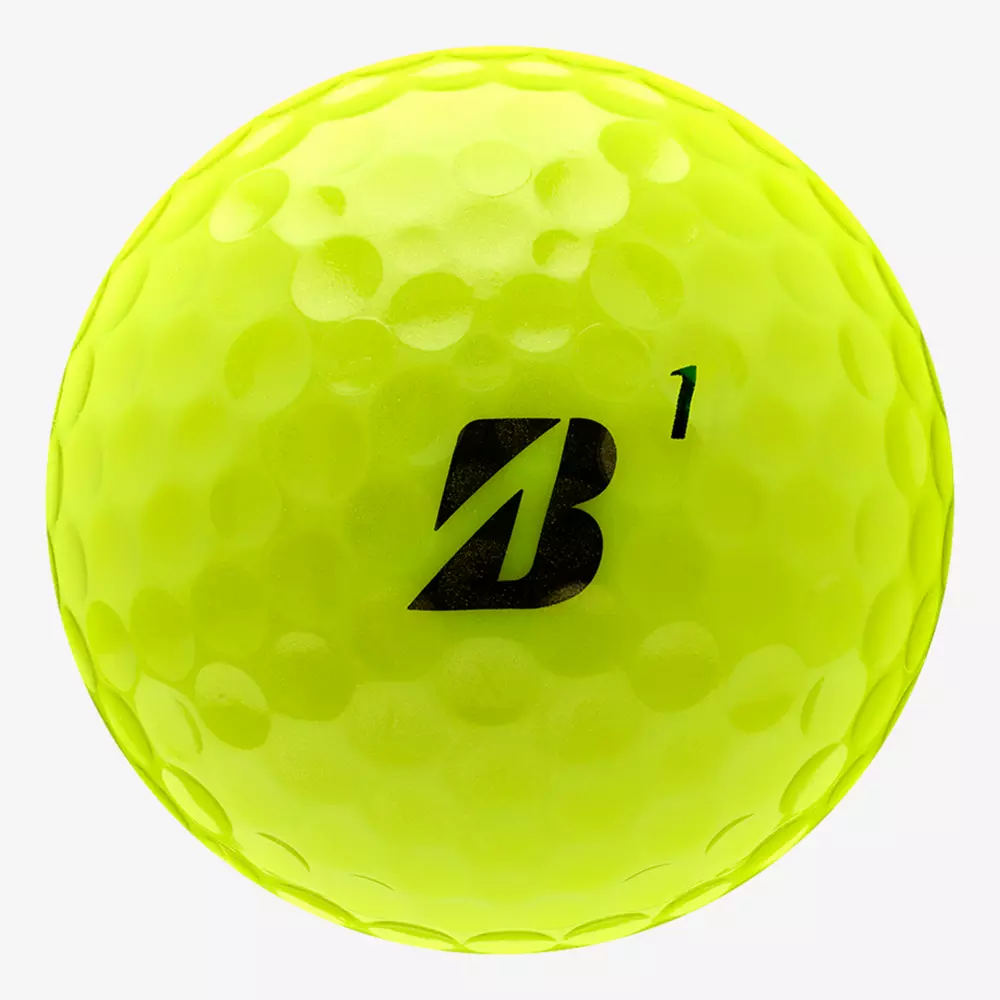 A bright yellow dimpled golf ball with a black B logo and the number 1 printed on it, shown on a plain white background&mdash;perfect for pairing with the best golf shoes 2026 for your next round.