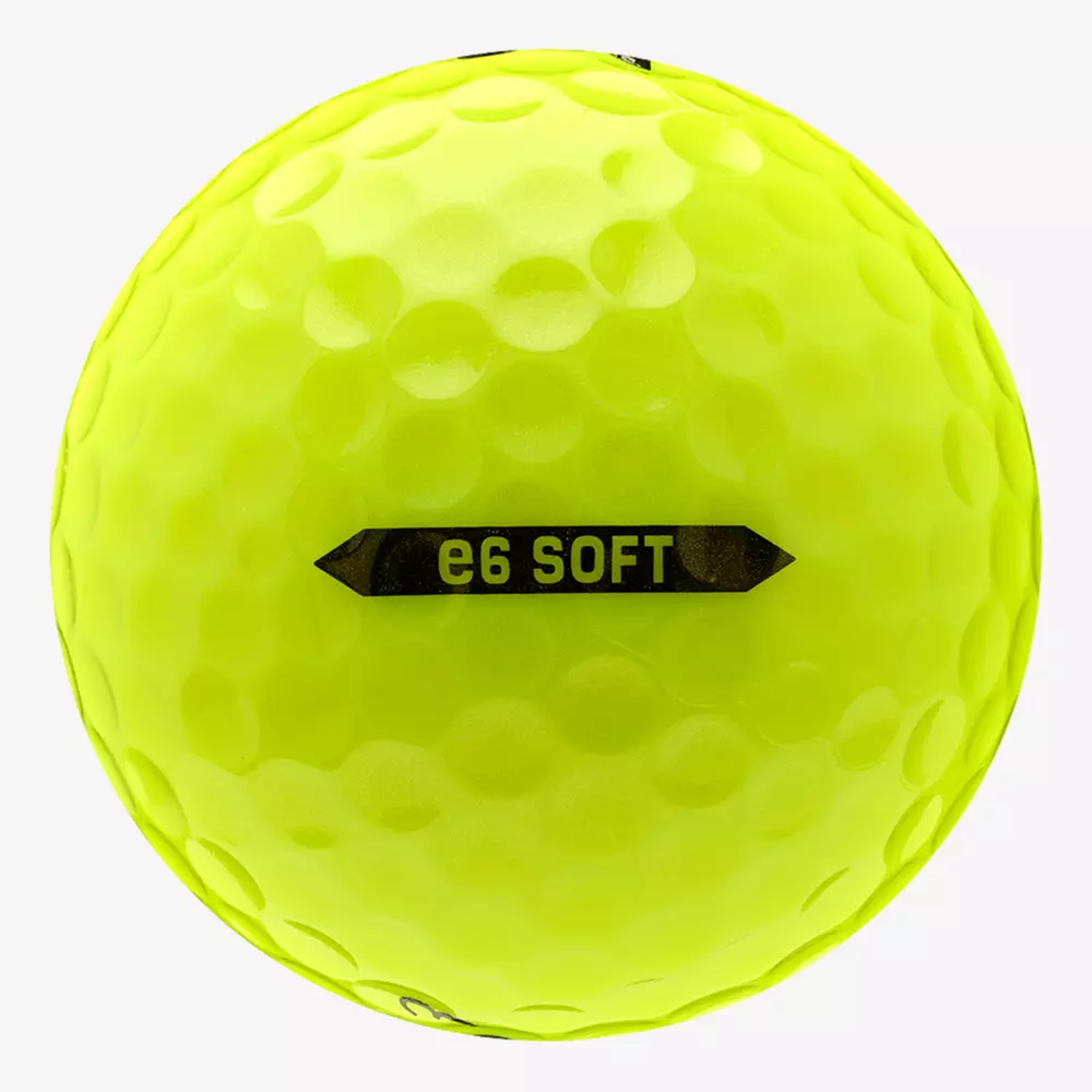 A close-up view of a bright yellow golf ball with a dimpled surface and the text e6 SOFT printed in black on the side, perfect for pairing with the best golf shoes 2026 for an unbeatable game.
