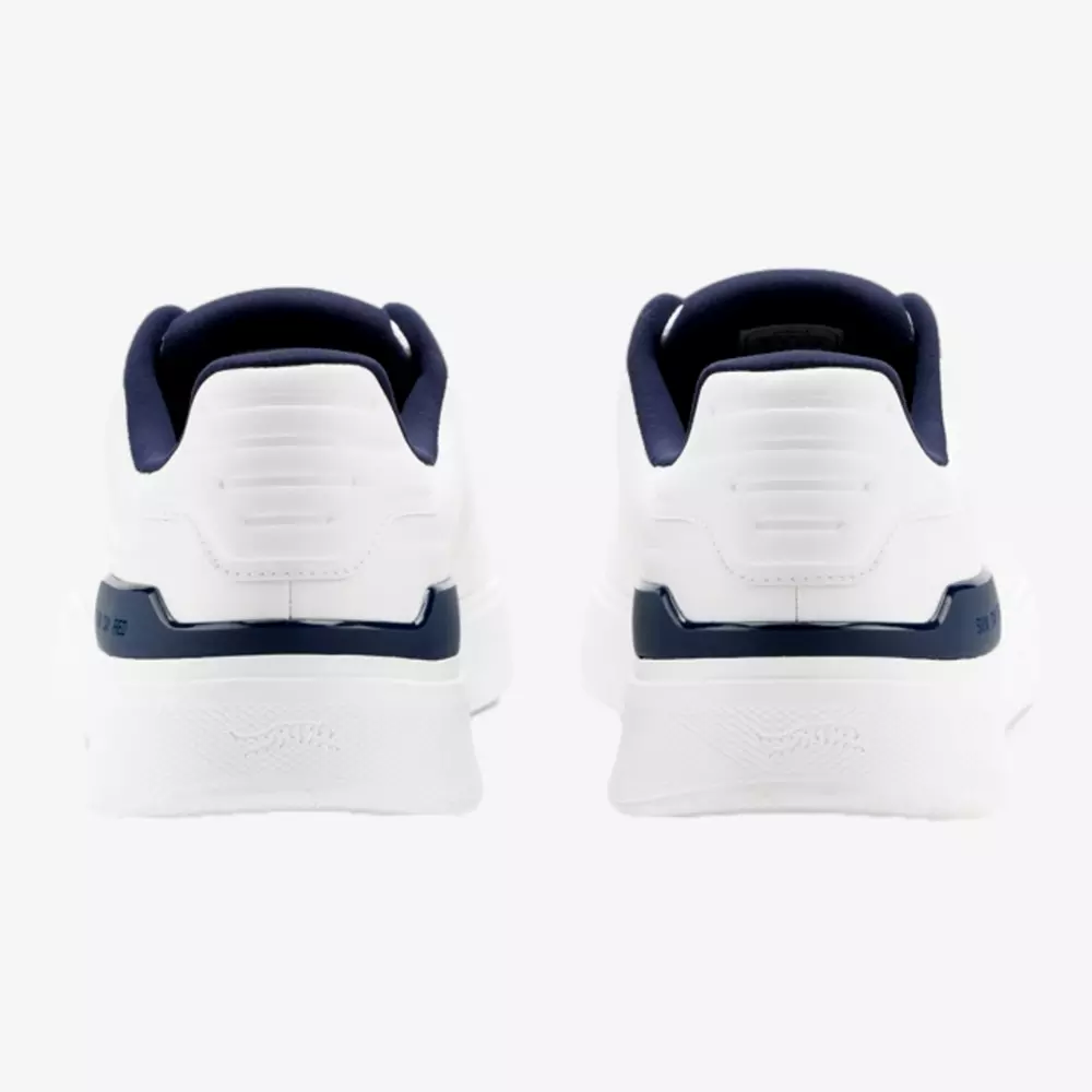 A pair of white sneakers with navy blue accents, inspired by the best golf shoes 2026, shown from the back against a plain white background.