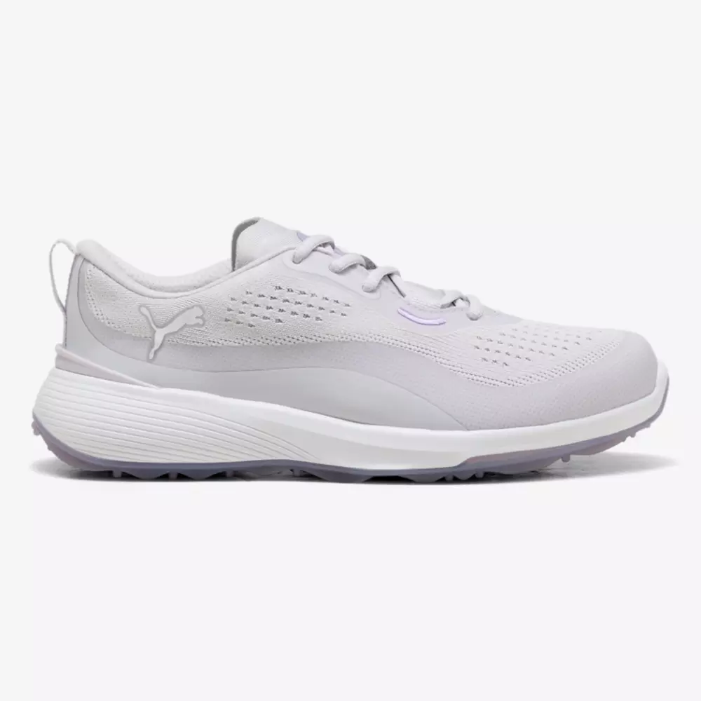 A side view of a light grey athletic sneaker, inspired by the best women's golf shoes 2026, featuring a textured sole, lace-up closure, and subtle logo detailing on the heel and side, set against a plain white background.