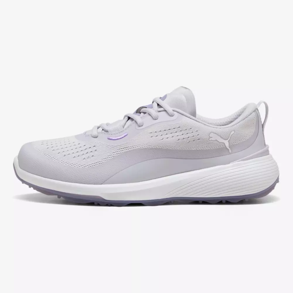 A light gray athletic sneaker with a textured sole, mesh upper, and the Puma logo on the side, shown in a side profile against a white background&mdash;ideal style inspired by the best women's golf shoes 2026.