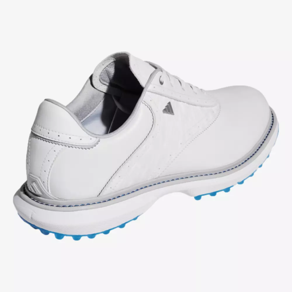 A white leather athletic shoe with a lace-up design, subtle stitching, and a small triangular logo on the side. With blue traction spikes and a light gray inner lining, it rivals some of the best Jordan golf shoes for both style and performance.