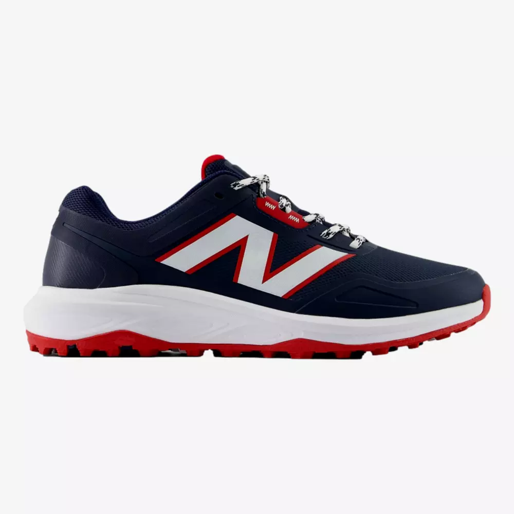 A navy blue and red athletic sneaker with a large white N logo on the side, white midsole, red and black sole, and patterned laces&mdash;perfect for those seeking a style inspired by the best Jordan golf shoes. Shown in side profile on a plain background.