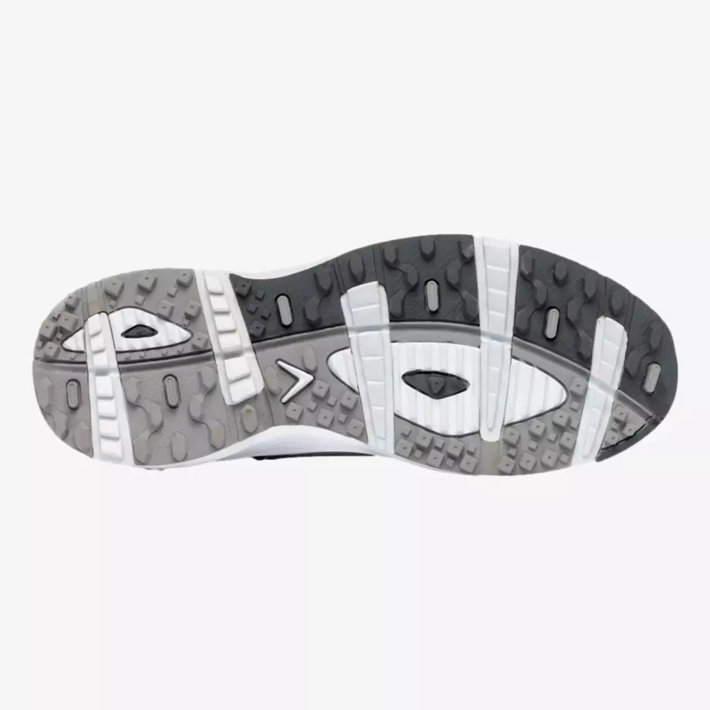 The image shows the bottom sole of a sneaker with a textured gray and white tread pattern designed for grip and traction, similar to the best Jordan golf shoes. The sole features multiple grooves and raised rectangular sections.
