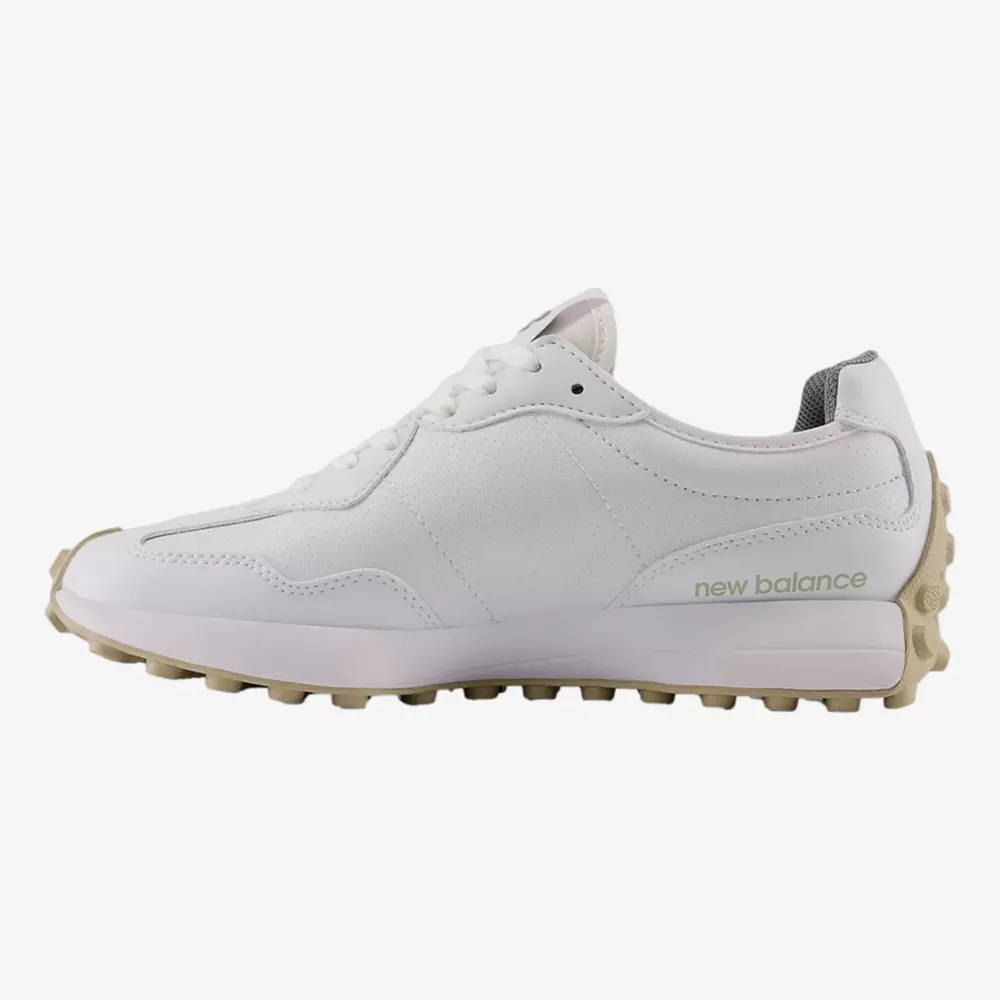A white New Balance sneaker with a beige textured sole, grey inner lining, and New Balance branding on the side, shown in a side profile on a plain white background&mdash;perfect style inspiration for the best golf shoes 2026.