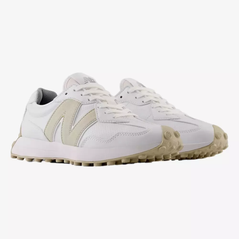 A pair of white athletic sneakers with beige accents and soles, featuring a large N logo on the side and textured outsoles, displayed on a plain white background&mdash;an ideal pick among the best golf shoes 2026.