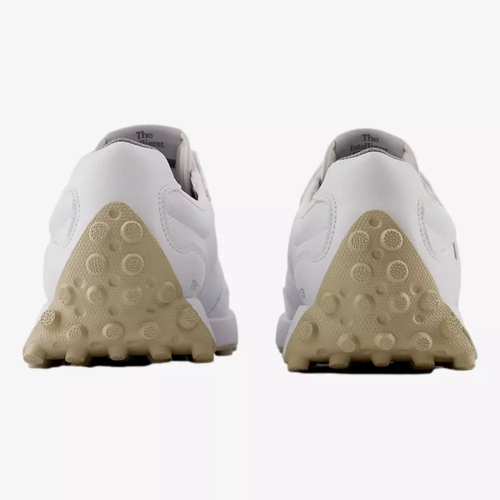 Rear view of two white athletic shoes with beige textured rubber soles and circular grip patterns, positioned side by side on a plain white background&mdash;perfect for those searching for the best golf shoes 2026.