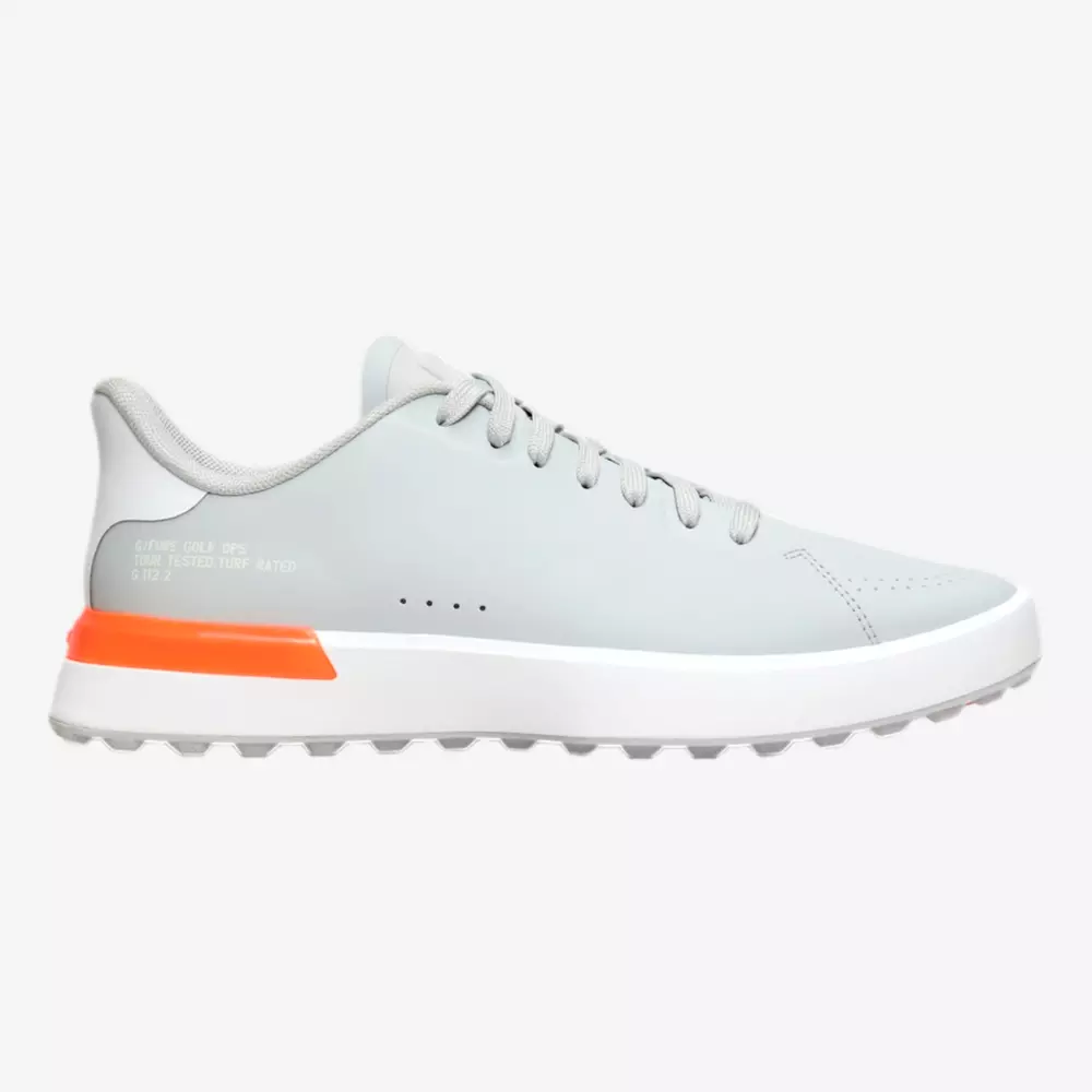 A light gray athletic sneaker with a white sole and an orange accent on the heel, featuring gray laces and a low-cut design&mdash;perfect for those seeking style inspired by the best Jordan golf shoes, displayed on a plain white background.