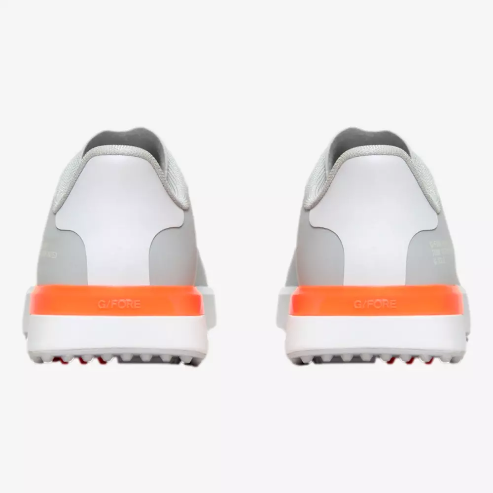 Rear view of a pair of white athletic shoes with gray collars and orange accents on the heels, displayed side by side on a white background. With textured outsoles and visible tread, they evoke the performance of the best Jordan golf shoes.