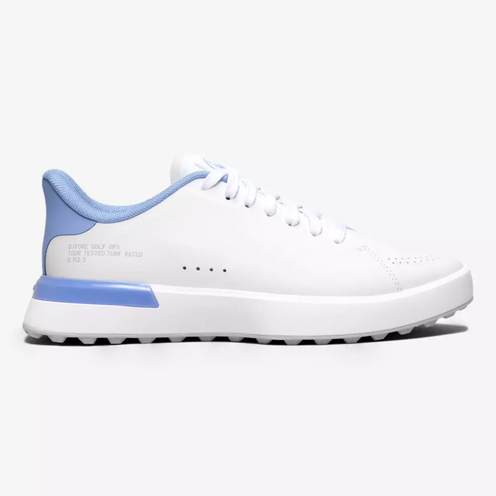A white athletic sneaker with light blue accents on the heel and collar, white laces, and a ridged white sole&mdash;perfect for style and comfort, inspired by the best golf shoes 2026&mdash;shown in a left side profile on a plain background.