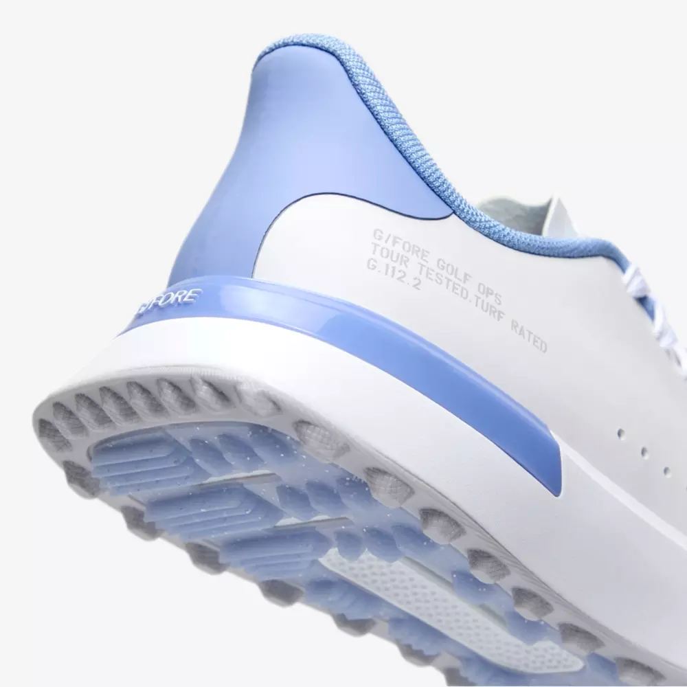 Close-up of the heel and sole of a white and light blue sneaker, showcasing the textured grip on the outsole&mdash;ideal traction for those seeking the best golf shoes 2026, with printed text visible on the side.