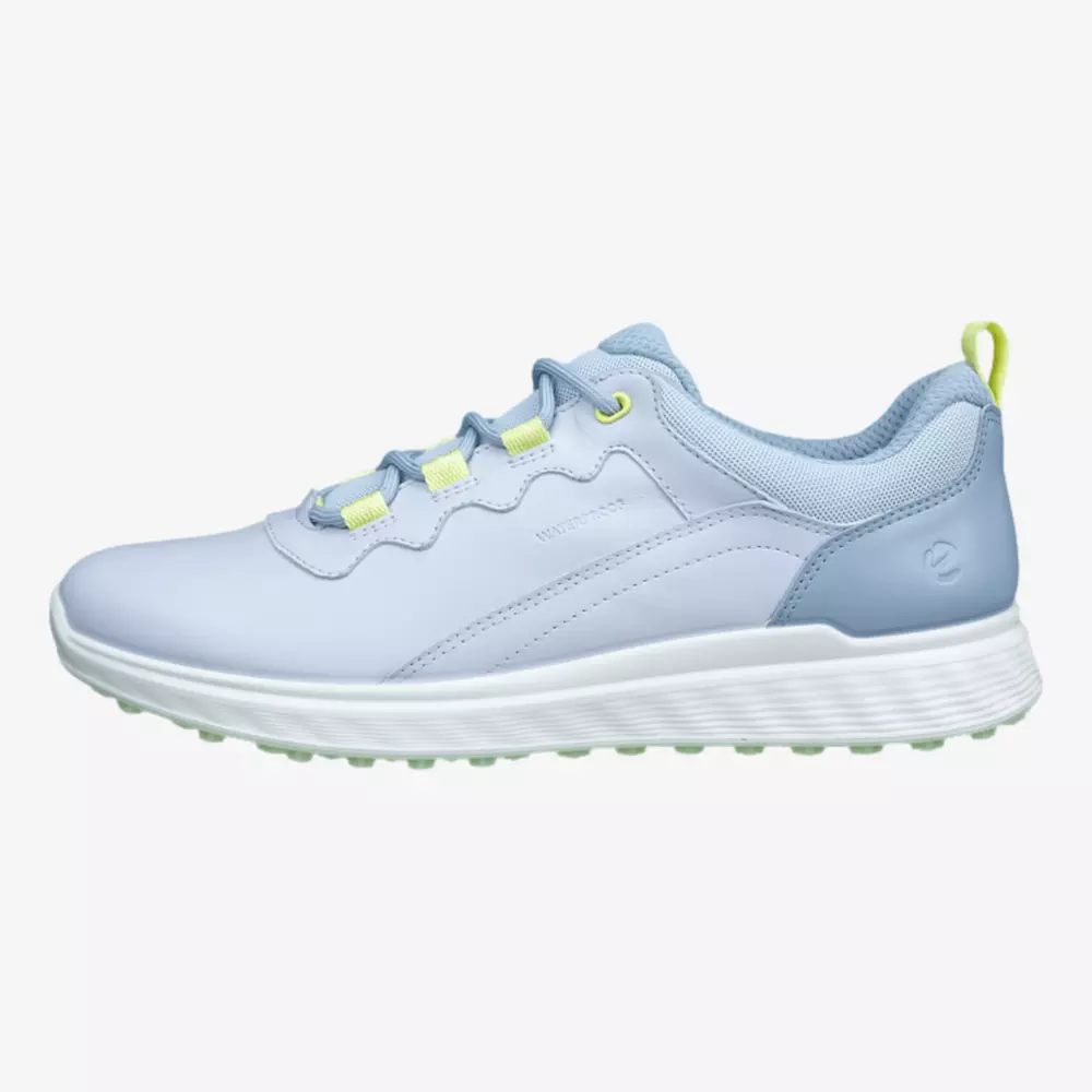 A light blue athletic sneaker with a white sole, light blue laces, and neon yellow accents on the eyelets and heel tab&mdash;perfect for those seeking the best golf shoes 2026, featuring a textured sole and a smooth upper design.