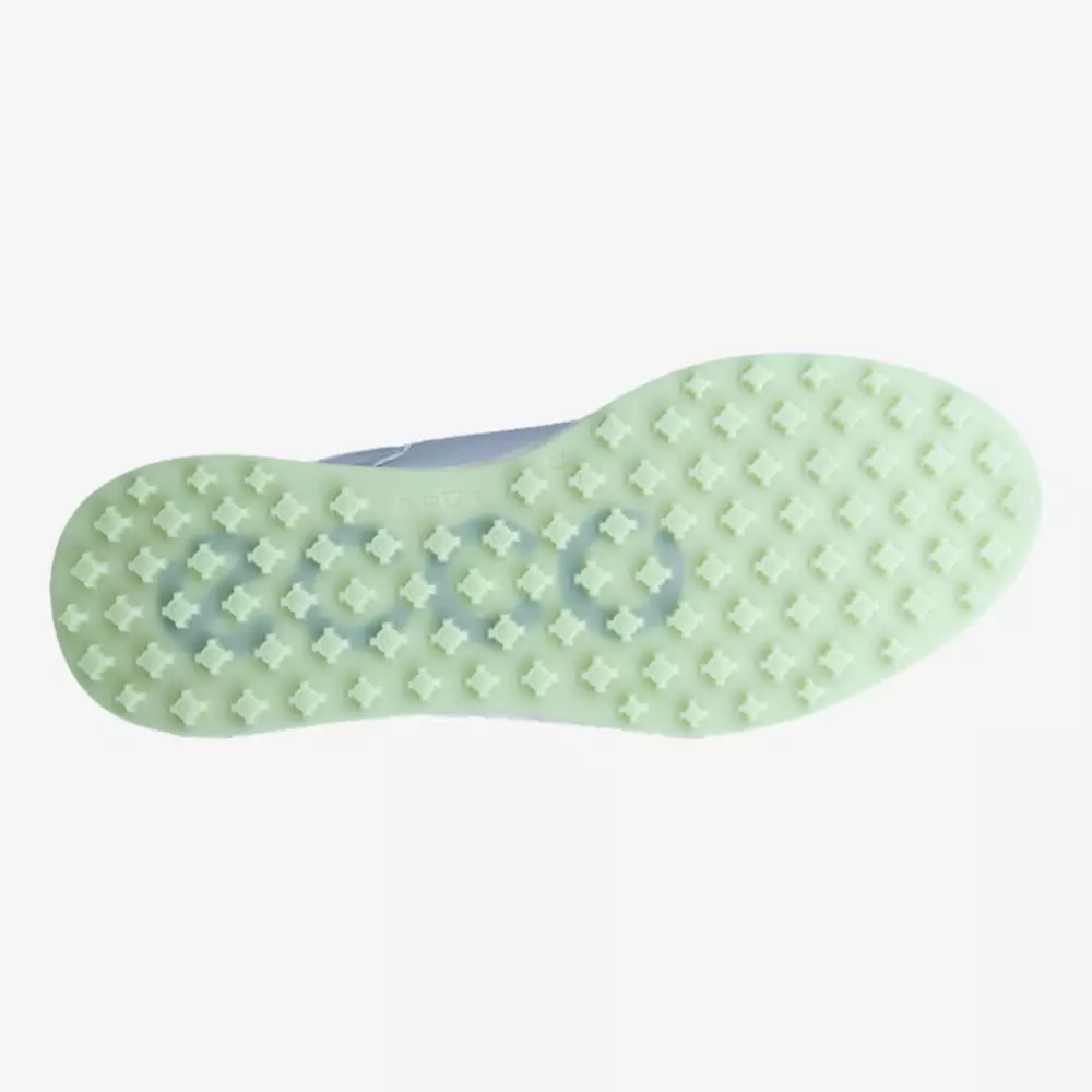 The image shows the sole of a light-colored shoe, featuring a pattern of small, evenly spaced X-shaped studs and the word ecco visible through the translucent material&mdash;an innovative design seen in some of the best golf shoes 2026 has to offer.