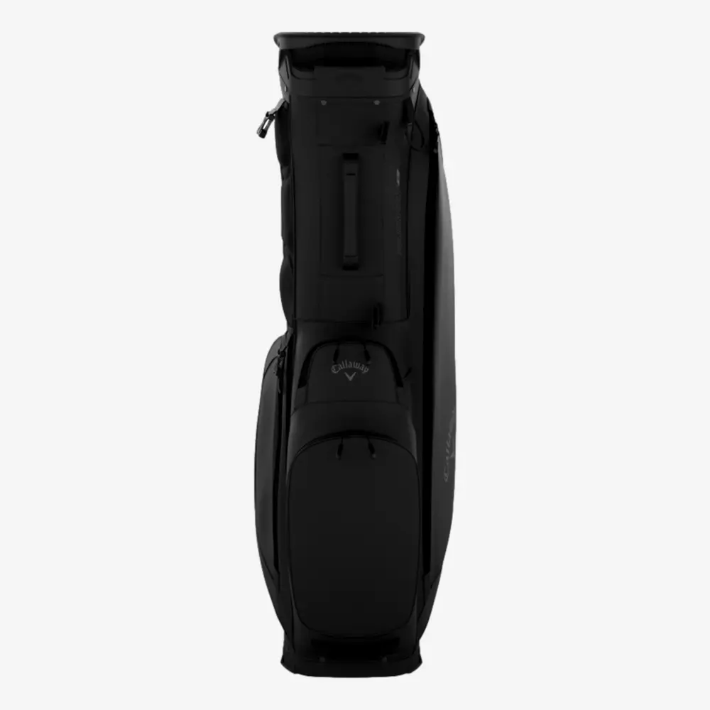 A black Callaway golf bag stands upright, viewed from the front, displaying several zippered compartments and the Callaway logo on the front pocket&mdash;an ideal choice among the best golf bags 2026.
