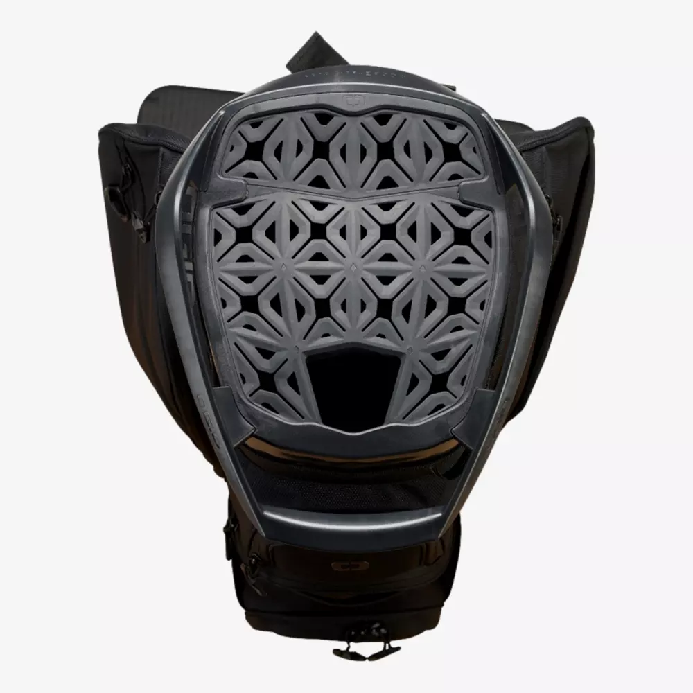 A black backpack with the top open, revealing a geometric, lattice-patterned back panel for ventilation and support&mdash;similar to the innovative designs seen in the best golf bags 2026. Interlocking shapes and an open area at the bottom center enhance airflow.