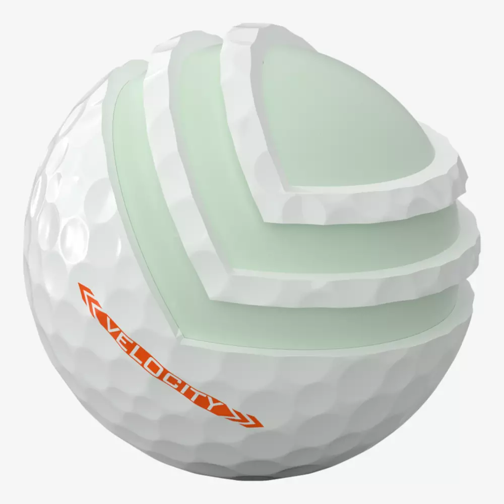 A golf ball with a cutaway section reveals its layered internal structure. The white, dimpled outer layer and orange &ldquo;VELOCITY&rdquo; label stand out&mdash;perfect for players searching for the best golf shoes 2026 to elevate their game.
