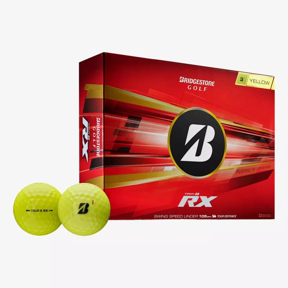 A red box of Bridgestone Golf Tour B RX yellow golf balls is displayed with two yellow golf balls in front, highlighting some of the best golf balls 2026 has to offer on a crisp white background.