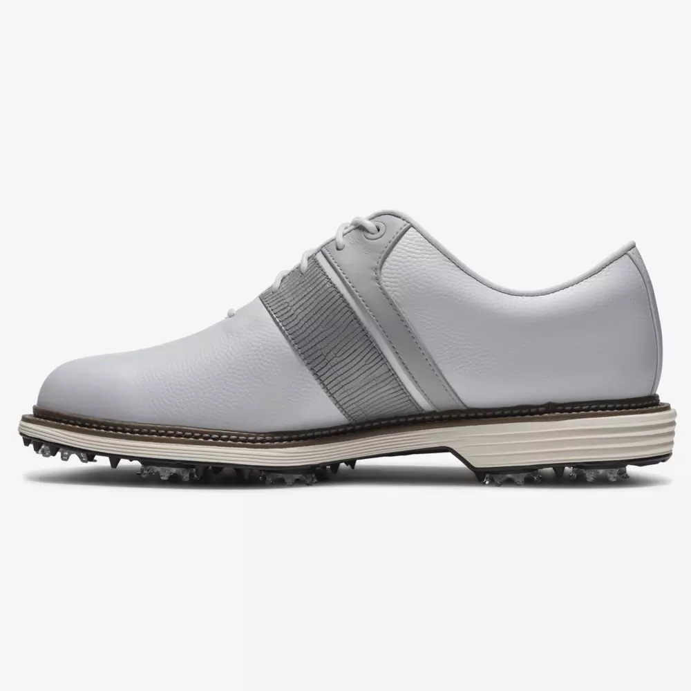 A white leather golf shoe with gray accents, lace-up closure, textured side panel, and spiked black rubber sole for optimal traction&mdash;an ideal choice for those seeking the best Jordan golf shoes on the course.