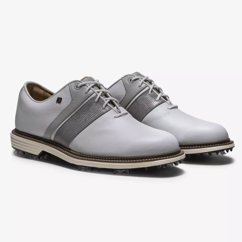 A pair of light gray leather golf shoes with white soles, dark gray accents, laces, and textured side details&mdash;these stylish sneakers are inspired by the best Jordan golf shoes and are displayed on a plain white background.