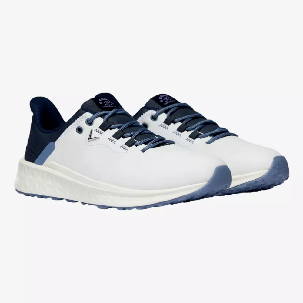 A pair of athletic sneakers with white uppers, navy blue laces, tongue, and heel, and light blue accents on the sole and eyelets&mdash;an inspired look reminiscent of the best golf shoes 2026&mdash;shown against a plain white background.