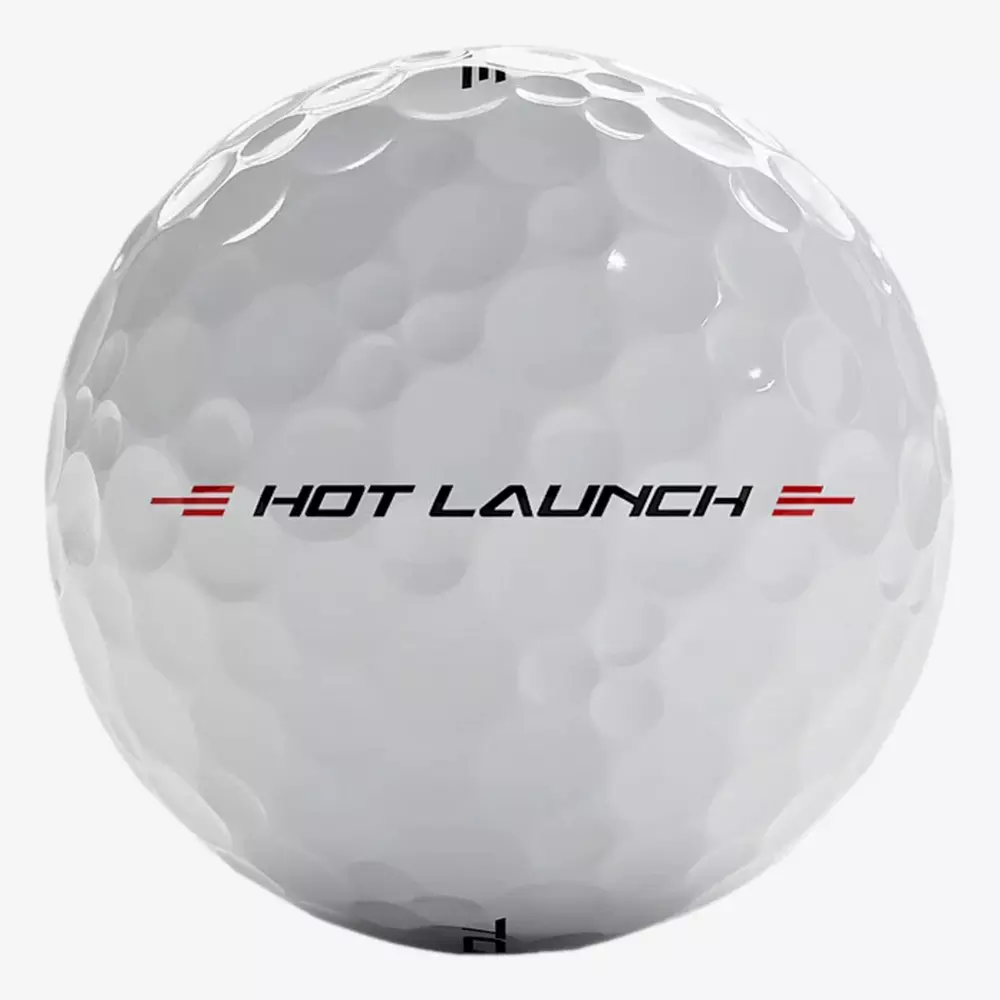 A white golf ball with visible dimples and the words HOT LAUNCH printed in black and red on its surface&mdash;perfect for pairing with the best golf shoes 2026 for an unbeatable game.