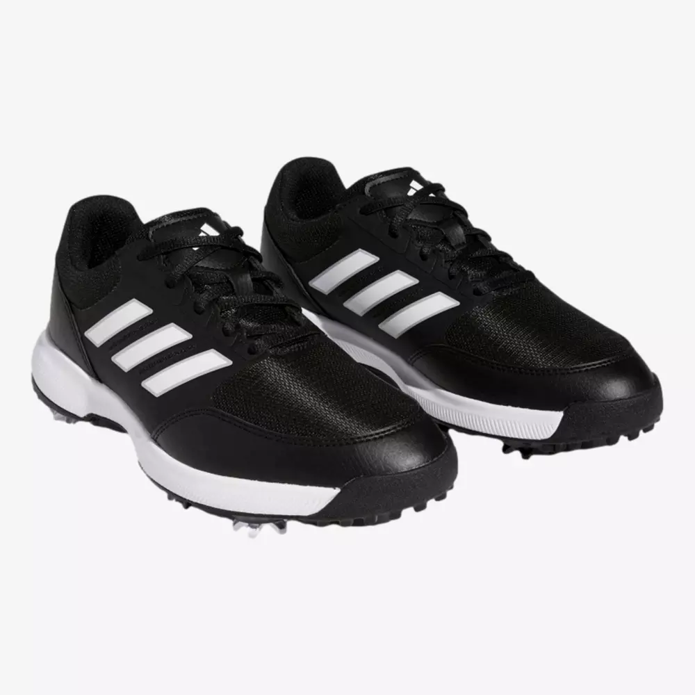 A pair of black athletic shoes with white soles and three white stripes on the sides, displayed on a plain white background&mdash;ideal for those seeking the best golf shoes 2026.