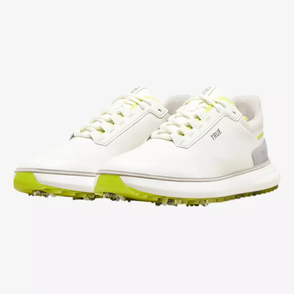 A pair of white athletic sneakers with light gray accents, neon yellow details on the sole and lining, and the word TRUE visible on the side. These modern, sporty shoes rival even the best Jordan golf shoes in style and comfort.