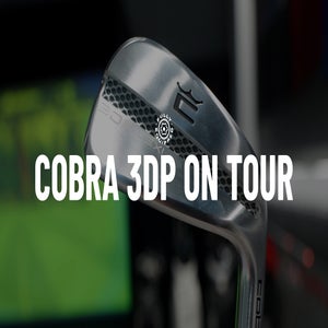 Close-up of a Cobra 3D-Printed golf club, with COBRA 3DP ON TOUR in bold white letters. The blurred green and dark background highlights its innovation among tour prototypes.