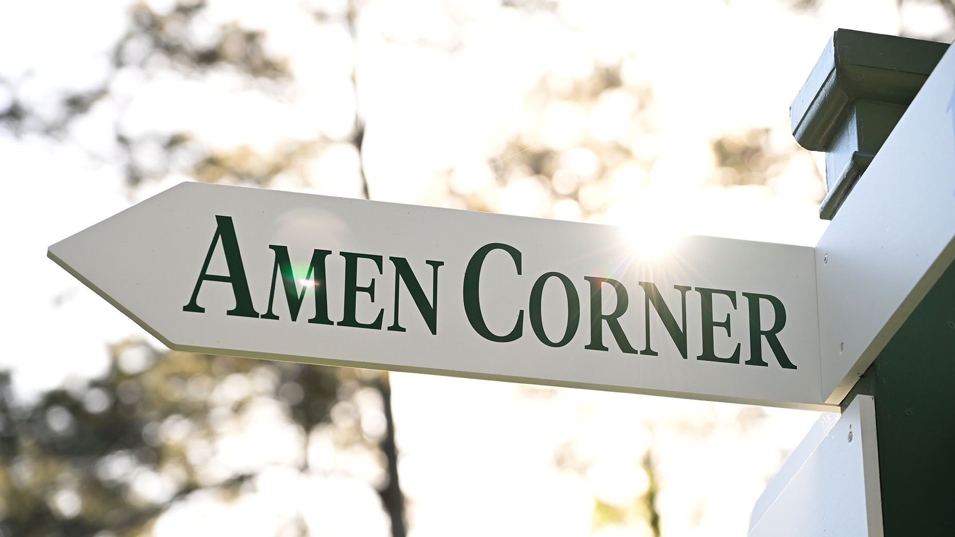 A white "Amen Corner" directional sign from Augusta National.