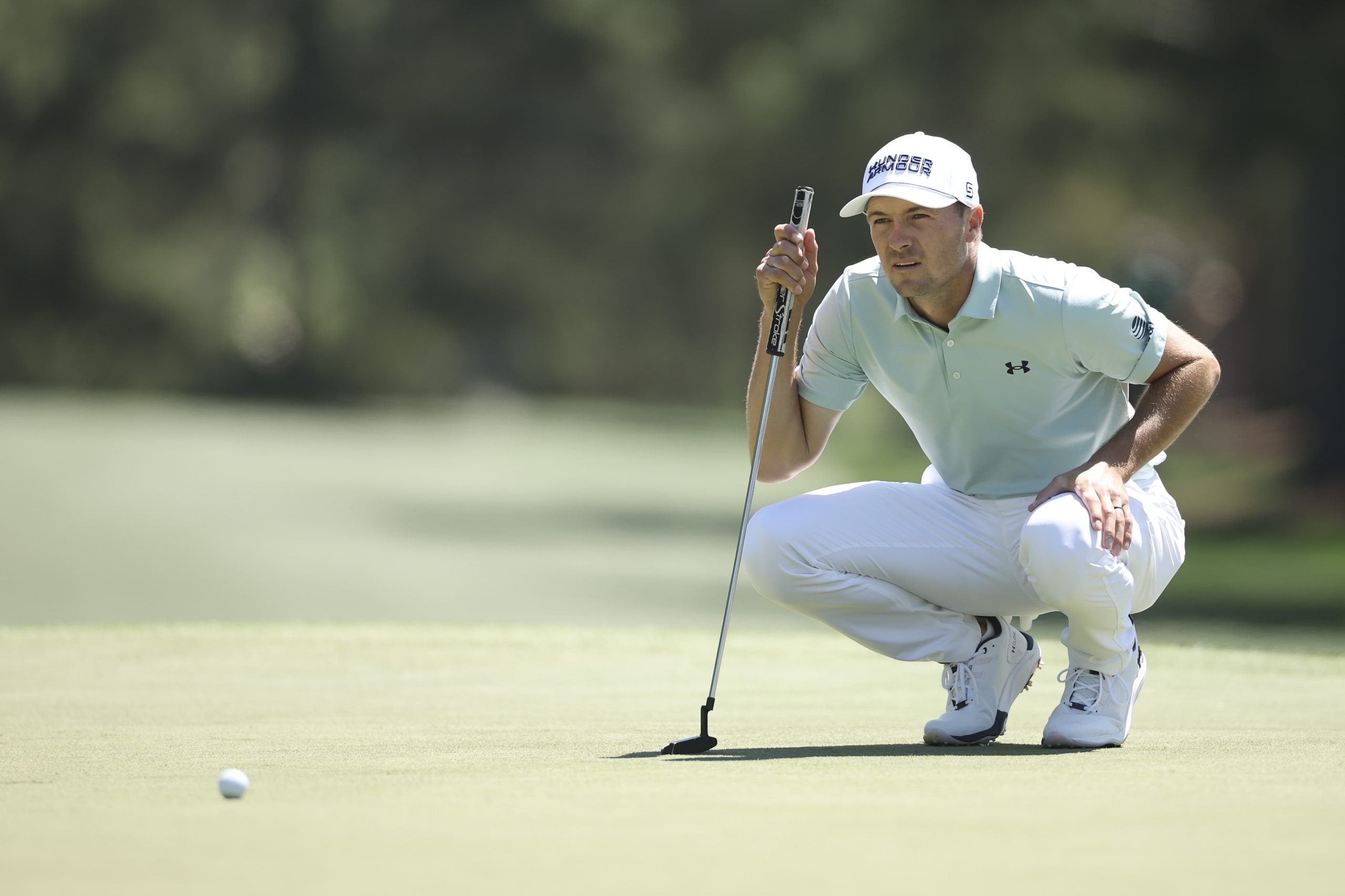 Jordan Spieth reads a put at Augusta wearing his new UA Golf Drive Pro Clone LE shoes