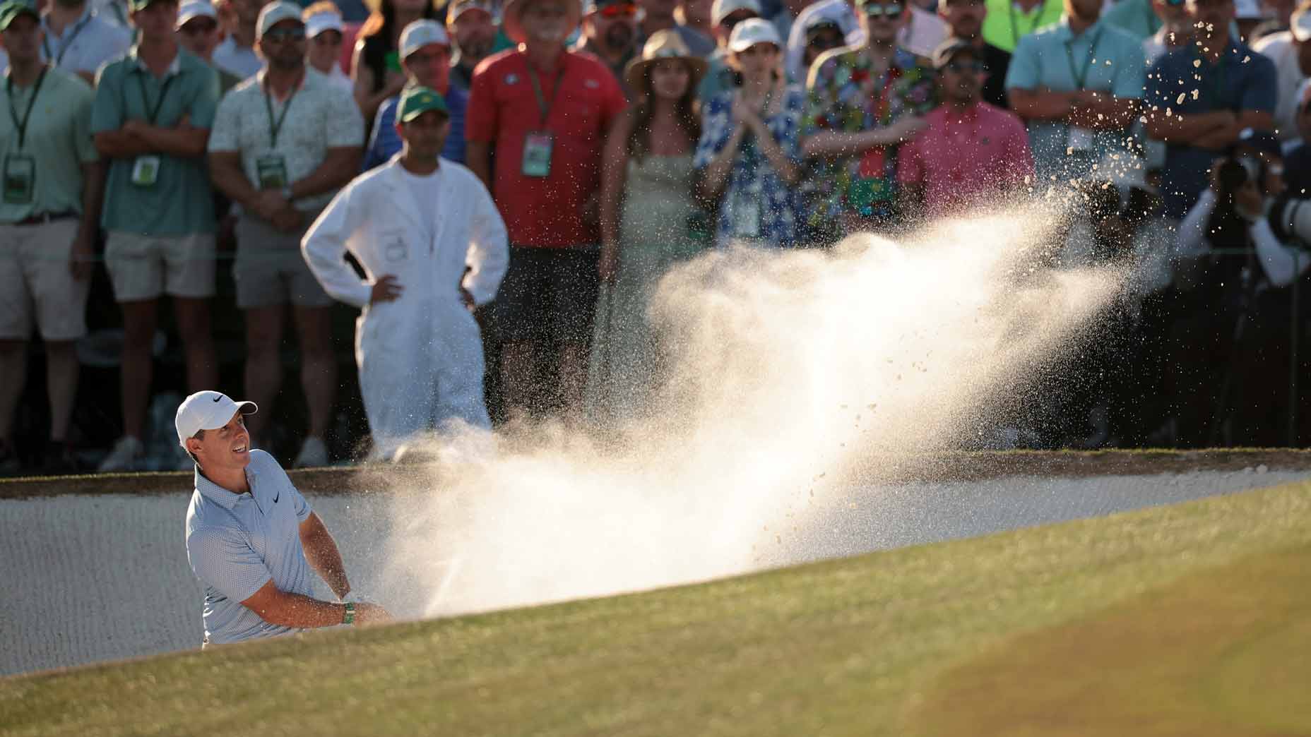 Rory McIlroy hits bunker shot on the 18th hole during the final round of the 2026 Masters Tournament