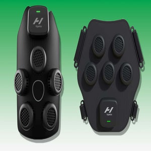 Two black hyperice wearable massage devices with multiple round massage nodes, ventilation holes, and a small display or button; placed on a green-to-white gradient background.