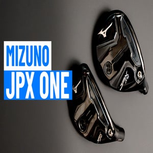 Two black Mizuno JPX ONE golf club heads, part of the Metalwoods range, are displayed on a dark surface beside bold text that reads MIZUNO JPX ONE in white and blue&mdash;perfect for any golf enthusiast.