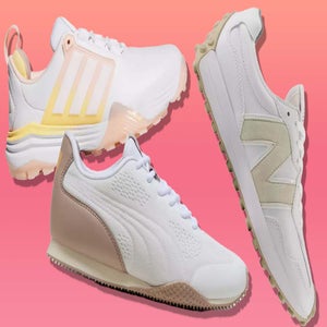 Three white shoes from different brands are displayed against a gradient pink background. Each shoe features unique beige or cream accents and distinctive designs, positioned diagonally for striking visual contrast.