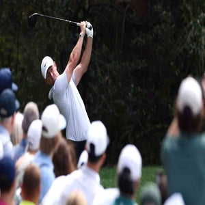 Rory McIlroy hits shot at Masters at Augusta National.