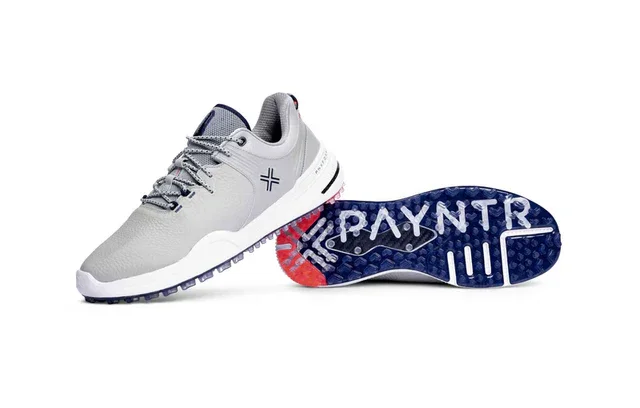 A pair of light gray athletic shoes with white soles. One shoe is upright, the other on its side, showing a blue and red sole with PAYNTR in white&mdash;designed to stand out among the best golf shoes 2026 has to offer.